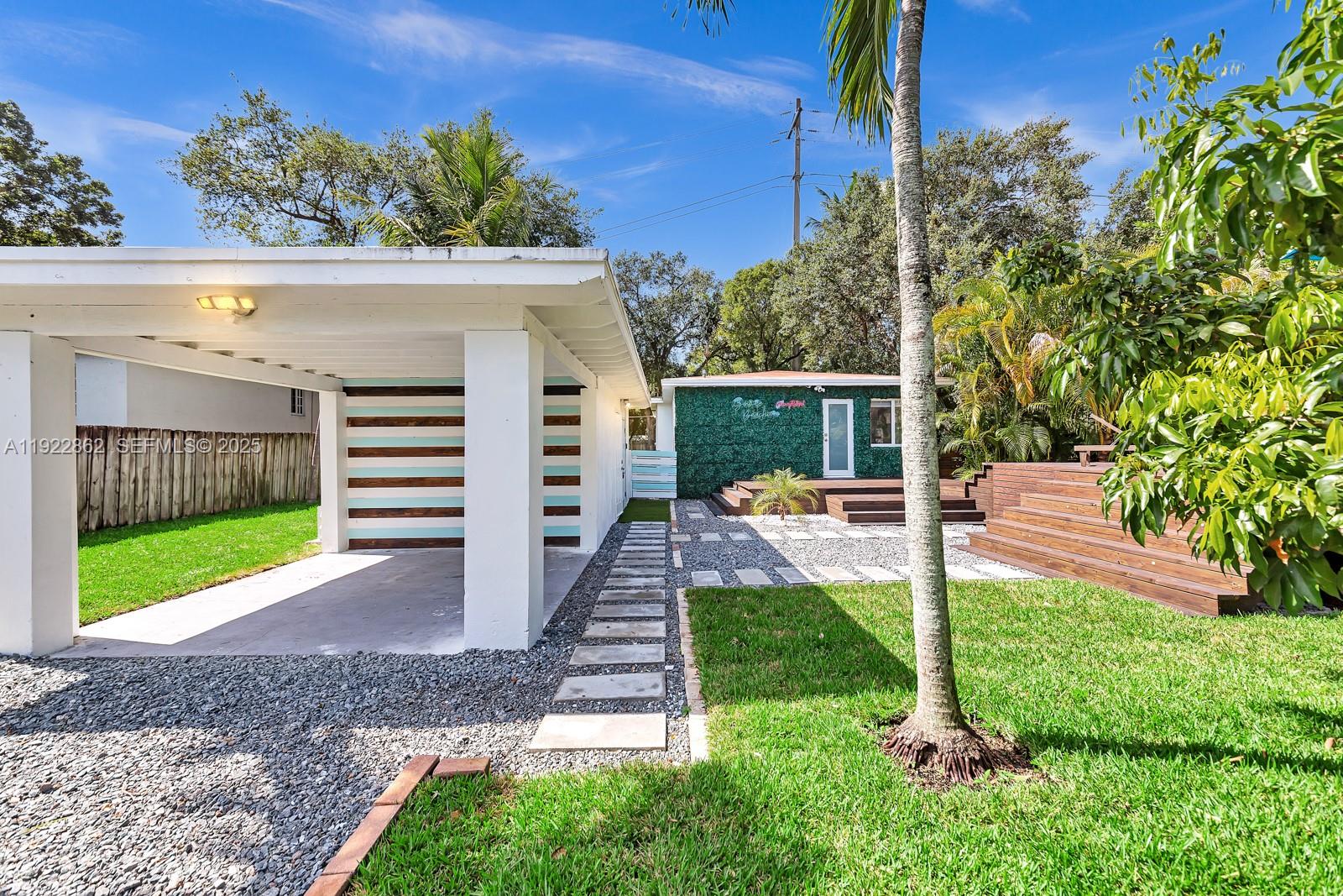 1960 Riverside Drive Fort Lauderdale, FL 33312 - Photo 88 of 89 a view of a chair and table in the garden