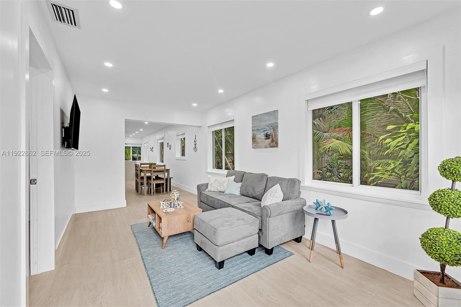 1960 Riverside Drive Fort Lauderdale, FL 33312 - Photo 10 of 89 a living room with furniture and a large window