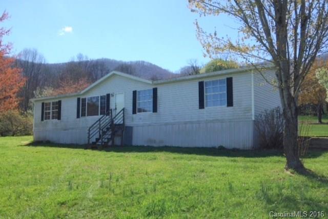 5237 Dutch Cove Road Canton, NC 28716 - Photo 1 of 7 a front view of a house with a garden