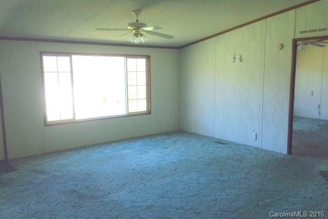 5237 Dutch Cove Road Canton, NC 28716 - Photo 2 of 7 an empty room with a window
