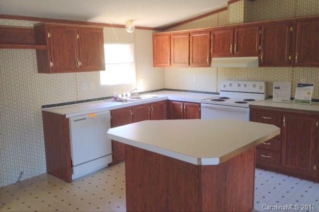 5237 Dutch Cove Road Canton, NC 28716 - Photo 3 of 7 a kitchen with a sink a stove and cabinets