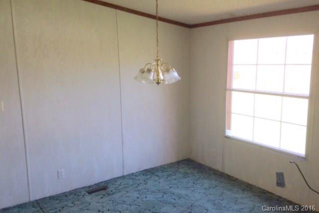 5237 Dutch Cove Road Canton, NC 28716 - Photo 4 of 7 an empty room with a window