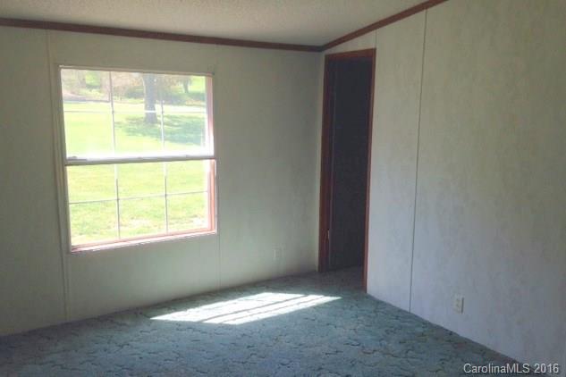 5237 Dutch Cove Road Canton, NC 28716 - Photo 6 of 7 an empty room with a window