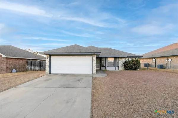 front view of a house with a street