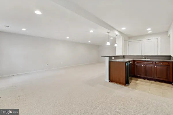 an empty room with a empty space and windows