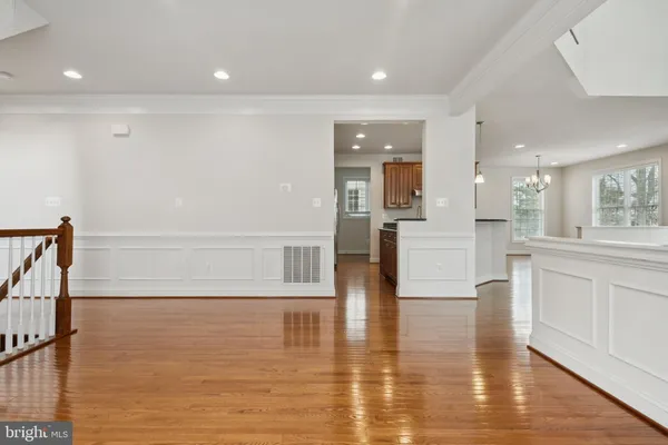 a view of kitchen and dining room with wooden floor