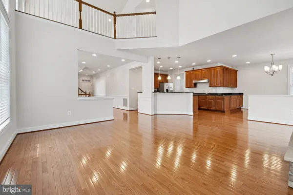 a view of kitchen with cabinets and wooden floor