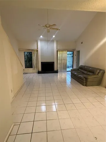 a view of a entryway with stairs and wooden floor