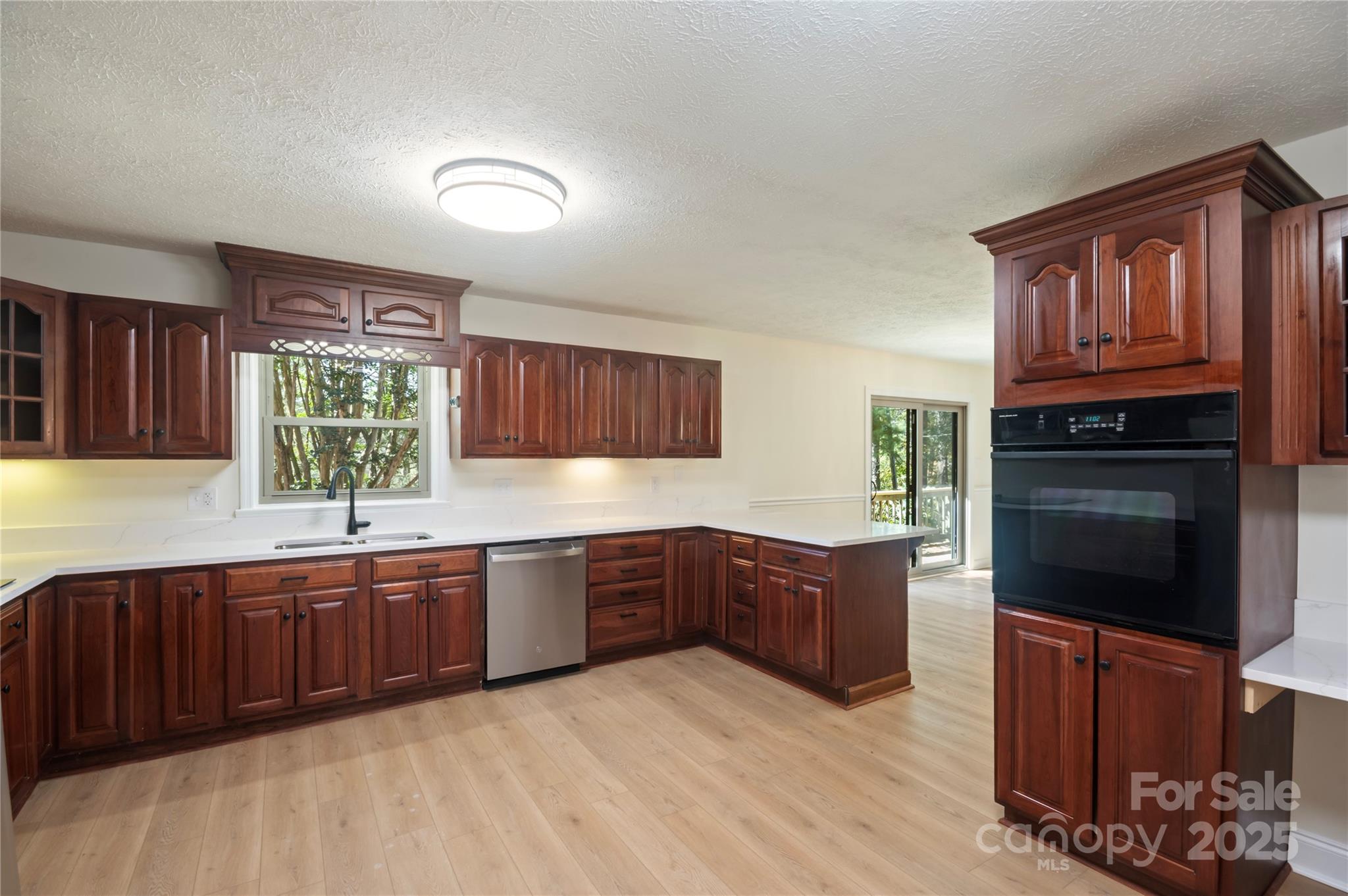 90 Joe Jenkins Road Fairview, NC 28730 - Photo 15 of 46 a kitchen with stainless steel appliances granite countertop a stove sink and cabinets