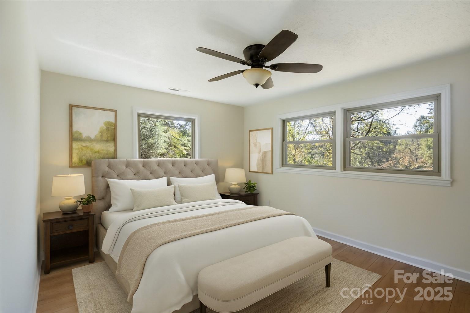 90 Joe Jenkins Road Fairview, NC 28730 - Photo 16 of 46 a bedroom with a large bed and a window