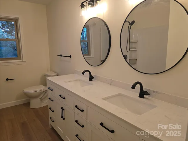 a bathroom with a toilet a sink and bathtub
