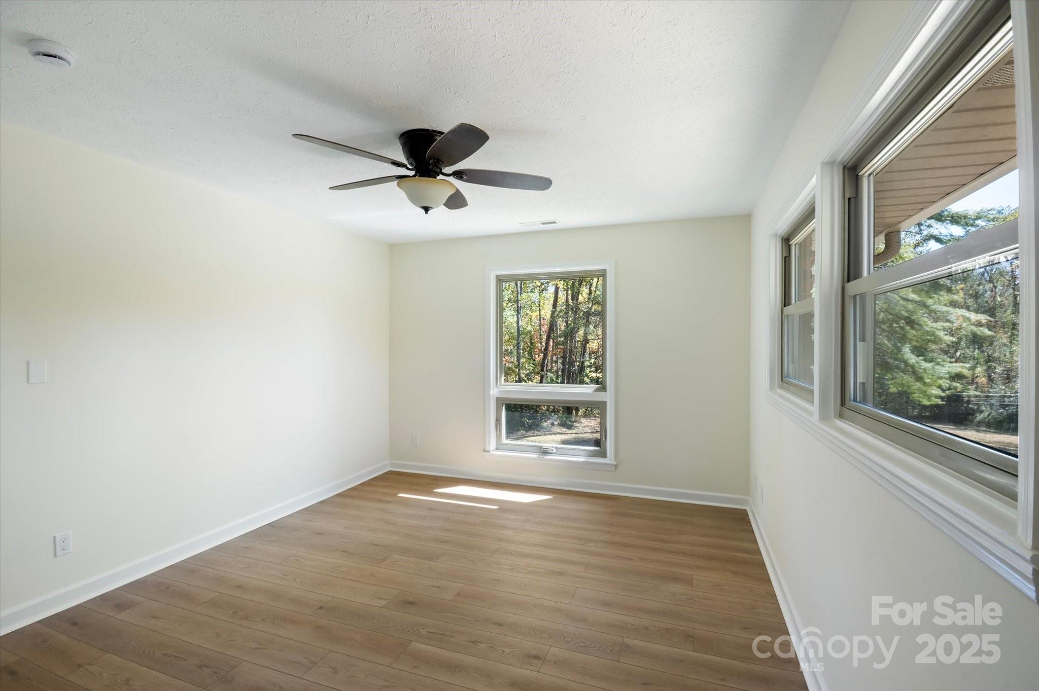 90 Joe Jenkins Road Fairview, NC 28730 - Photo 20 of 46 a view of an empty room with a window