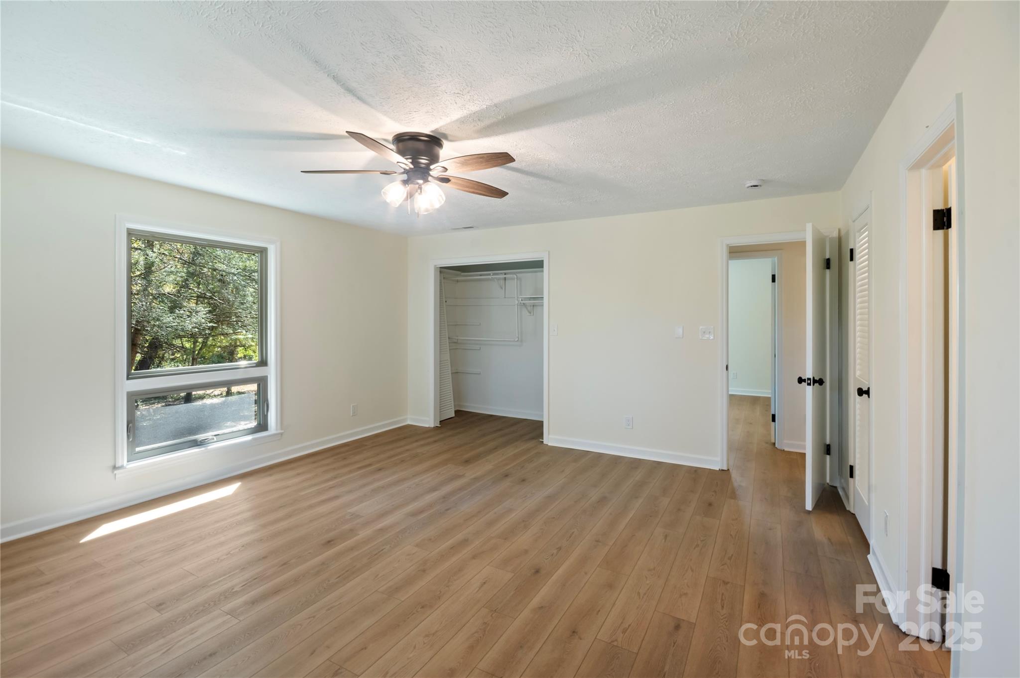 90 Joe Jenkins Road Fairview, NC 28730 - Photo 24 of 46 a view of an empty room with a window