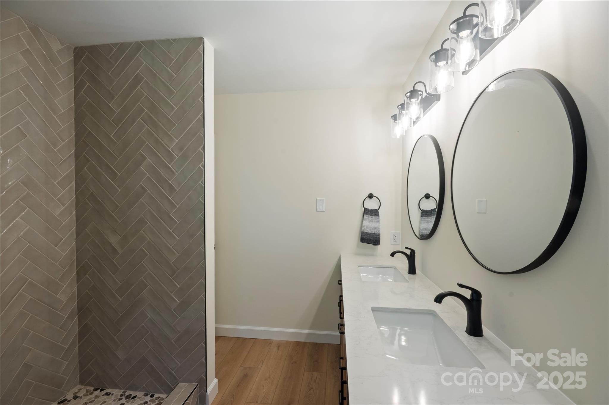 90 Joe Jenkins Road Fairview, NC 28730 - Photo 27 of 46 a bathroom with a sink and a mirror