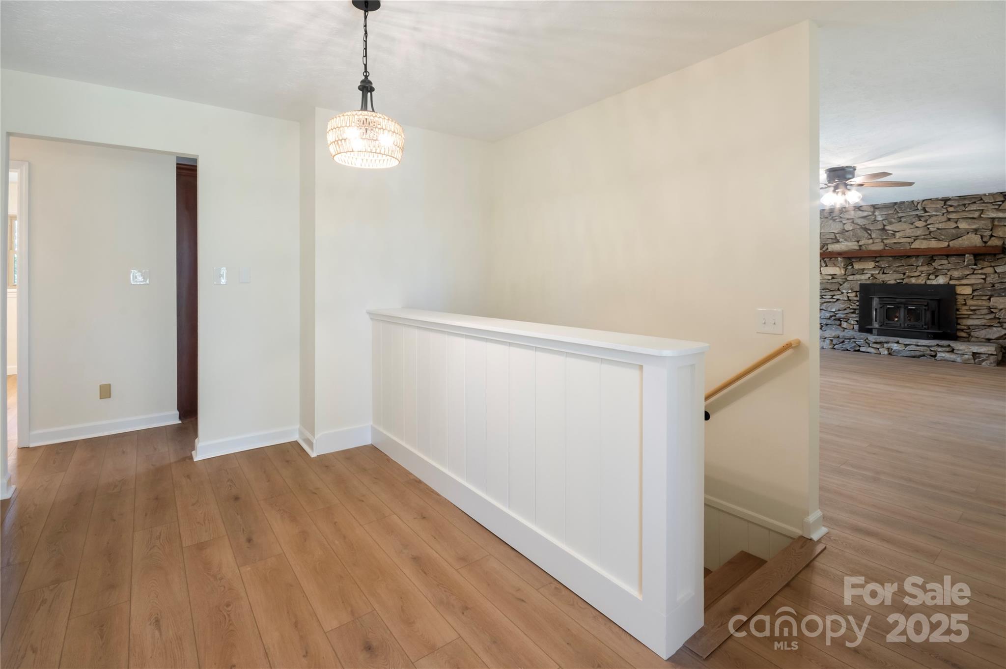 90 Joe Jenkins Road Fairview, NC 28730 - Photo 5 of 46 a view of an empty room with wooden floor and a window