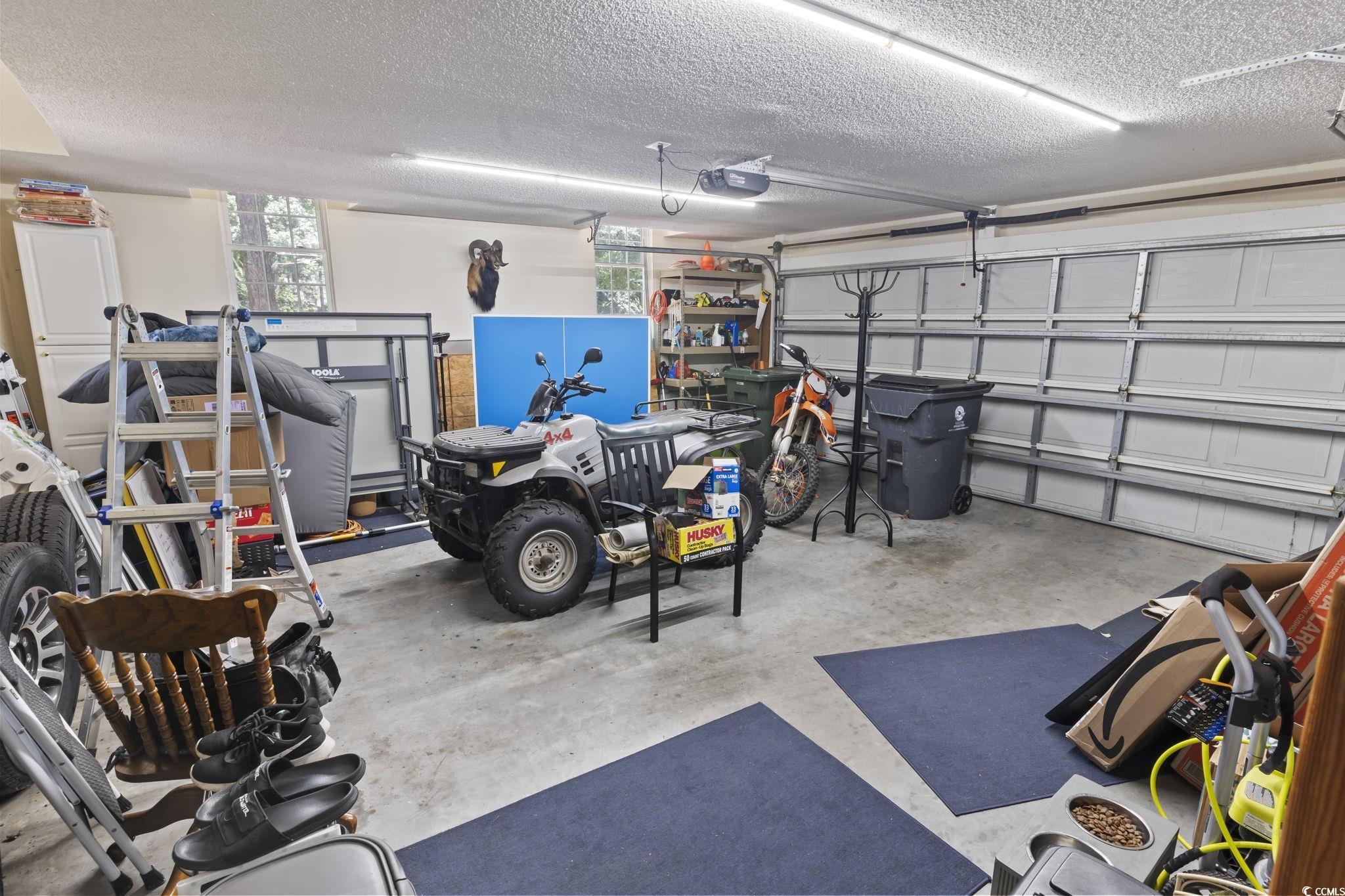 4495 Trotters Court Murrells Inlet, SC 29576 - Photo 13 of 29 Garage featuring a garage door opener