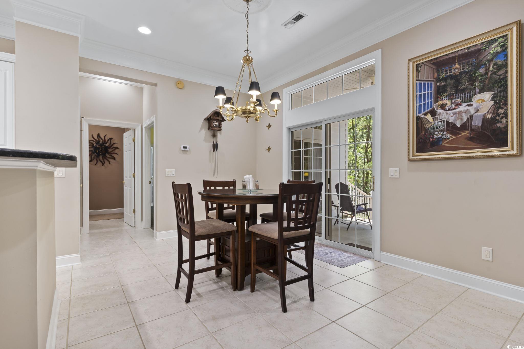 4495 Trotters Court Murrells Inlet, SC 29576 - Photo 20 of 29 Dining space featuring a chandelier, ornamental molding, light tile patterned floors, and recessed lighting