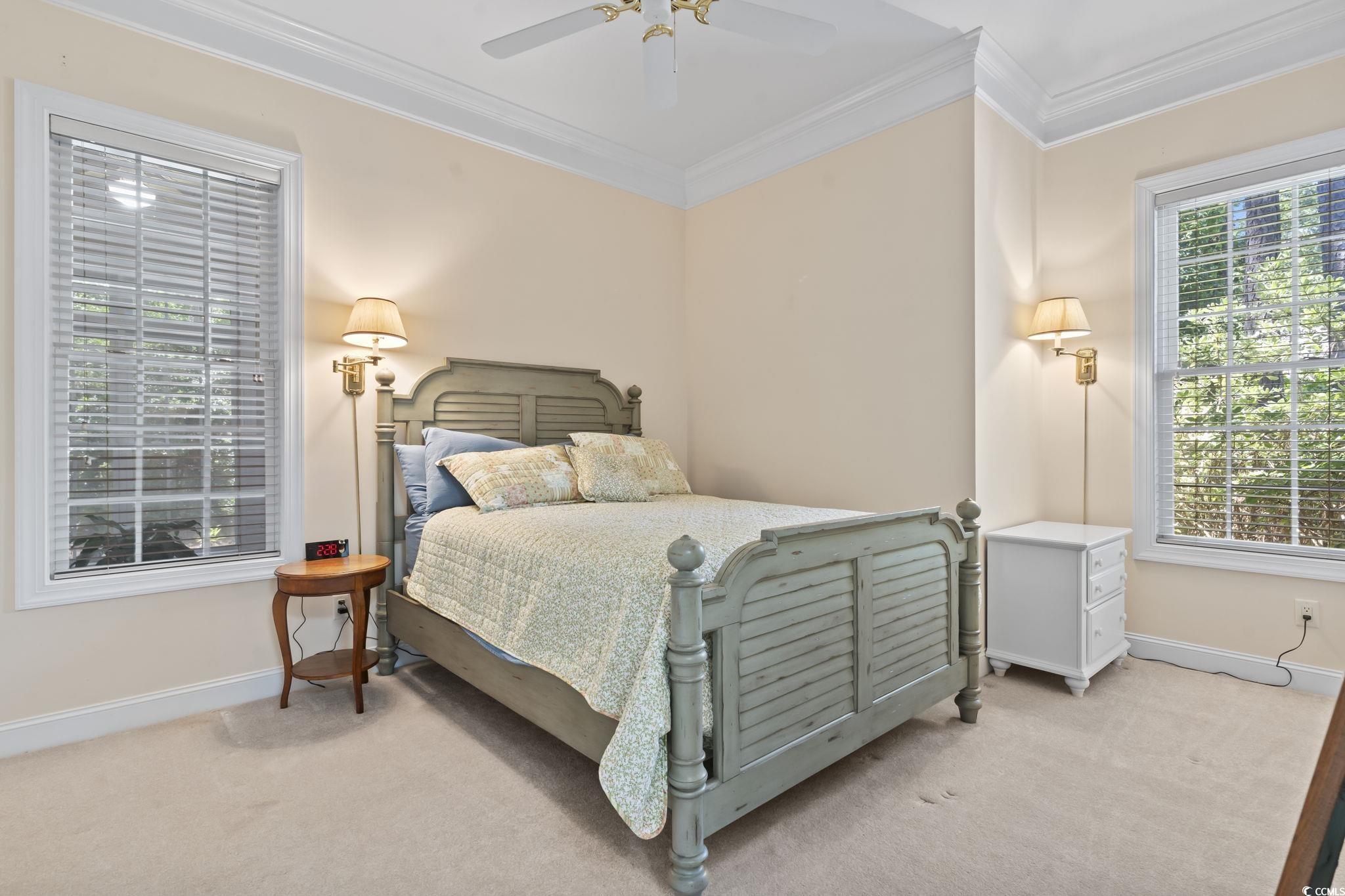 4495 Trotters Court Murrells Inlet, SC 29576 - Photo 8 of 29 Bedroom with light colored carpet, ornamental molding, and a ceiling fan