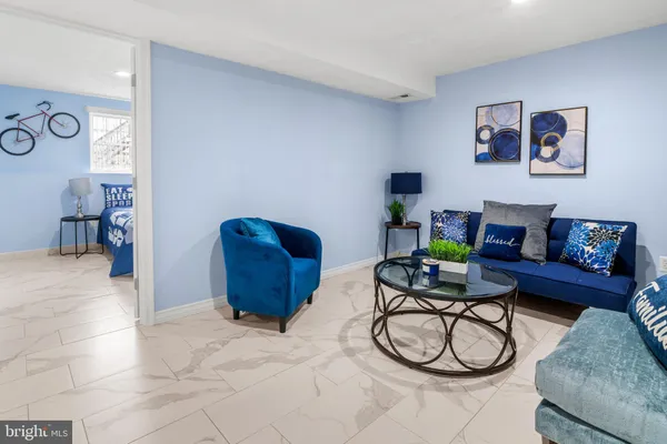 a living room with furniture a couch and cabinets