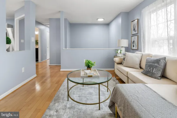 a living room with furniture and a table