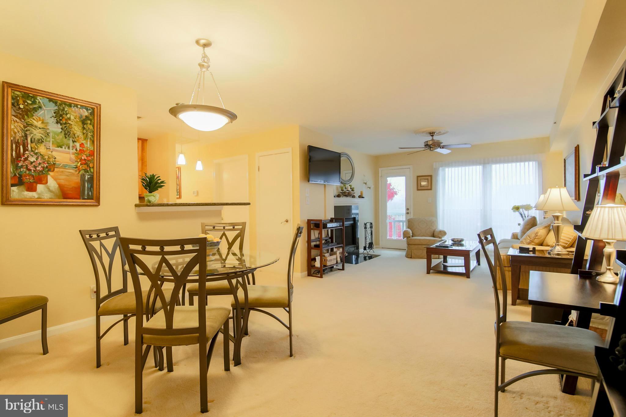 3175 Summit Square Drive, Unit 5E8 Oakton, VA 22124 - Photo 2 of 27 Dining Room into Living Room