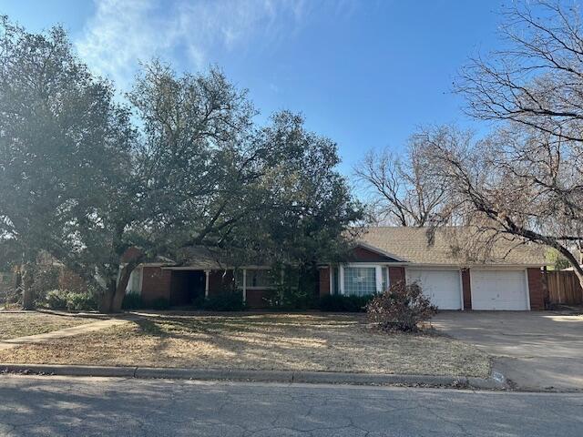 4503 14th Street Lubbock, TX 79416 - Photo 3 of 17 a view of a house with a yard