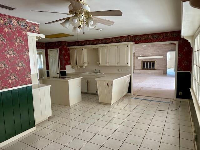 4503 14th Street Lubbock, TX 79416 - Photo 10 of 17 a large kitchen with cabinets and stainless steel appliances