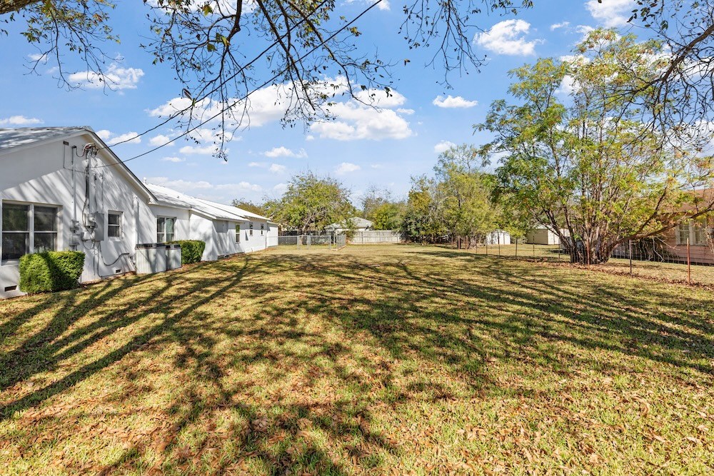 802 Apple Street, Unit 2 Fredericksburg, TX 78624 - Photo 4 of 6 a view of outdoor space with deck and large trees
