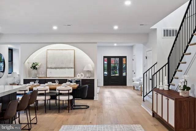 a view of a a dining room with furniture window and wooden floor