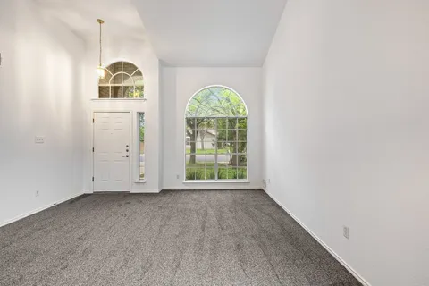 an empty room with windows