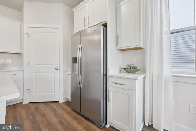 a view of cabinets and wooden floor