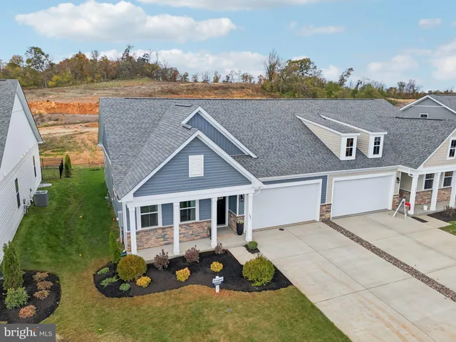 an aerial view of a house with a garden and plants