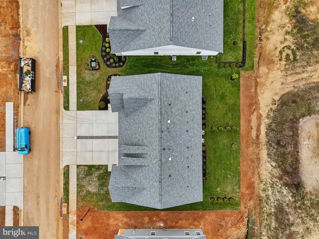 aerial view of a house with a yard