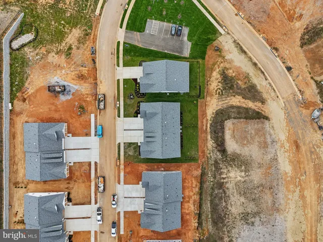 an aerial view of residential building and ocean view