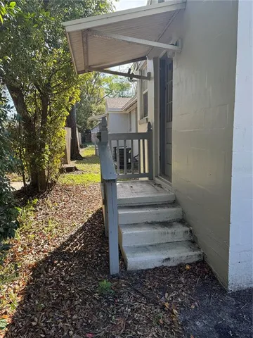 a view of a pathway of a house with a fountain