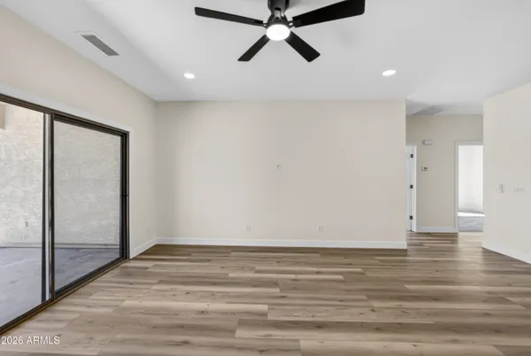 a view of open kitchen with wooden floor and a sink