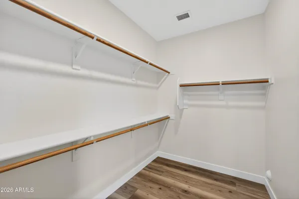 a view of a room with a ceiling fan