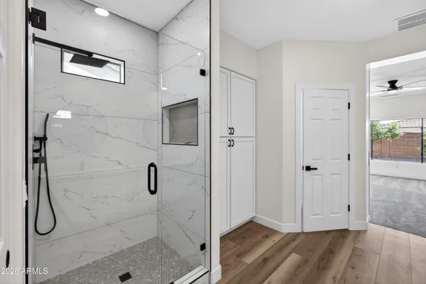 a view of an empty room with a window