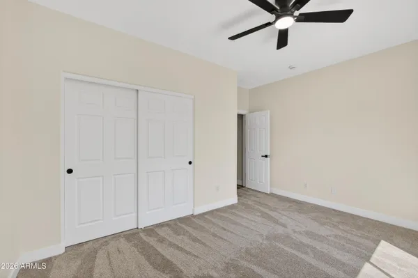 a view of room with window and hallway