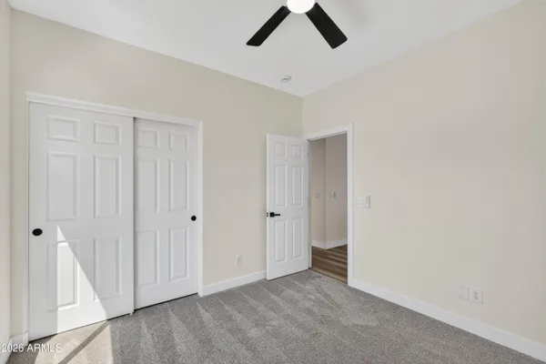 a view of a house with a yard and garage