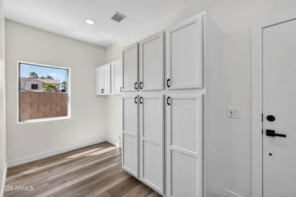 a view of balcony with wooden floor