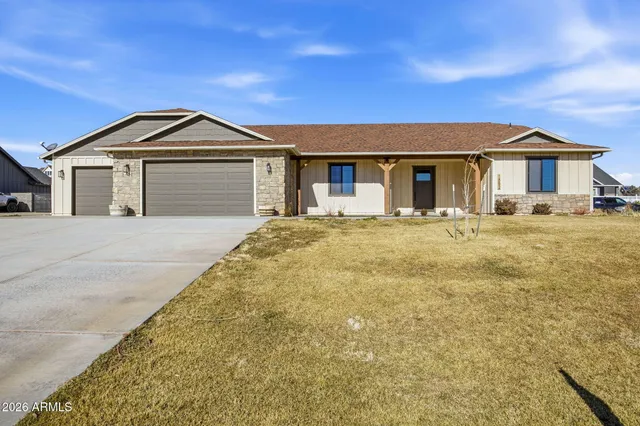 a front view of a house with yard