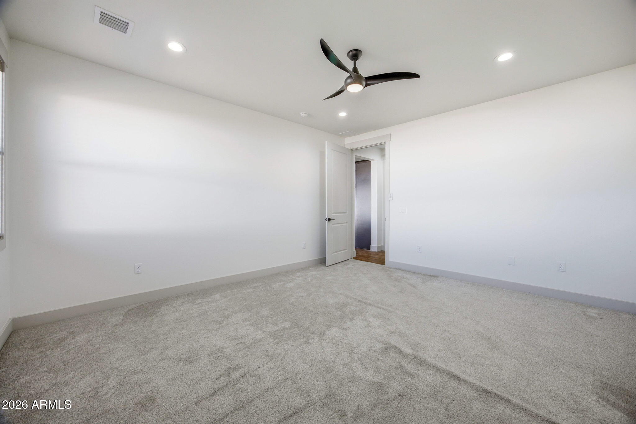 1852 West 7th S Street Snowflake, AZ 85937 - Photo 13 of 37 an empty room with a ceiling fan and window