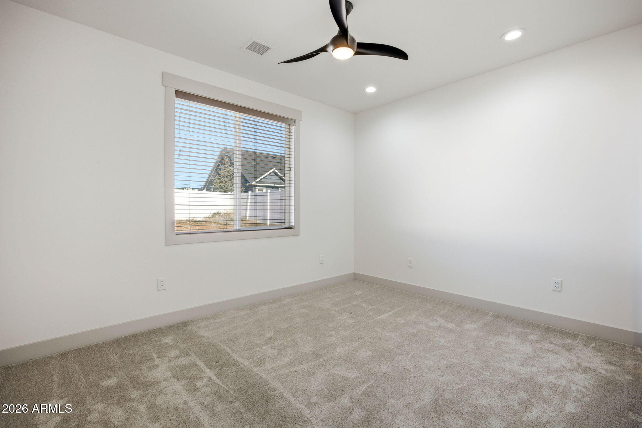 1852 West 7th S Street Snowflake, AZ 85937 - Photo 23 of 37 an empty room with windows and fan