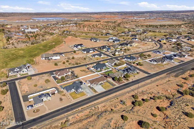 an aerial view of residential building and ocean view
