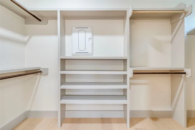 a spacious bathroom with a sink and a mirror