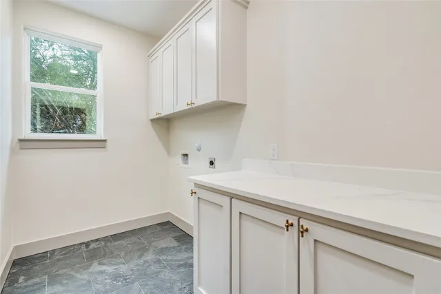 a view of an empty room with a ceiling fan