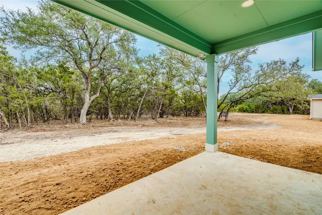 a view of a bathroom with a shower and a window