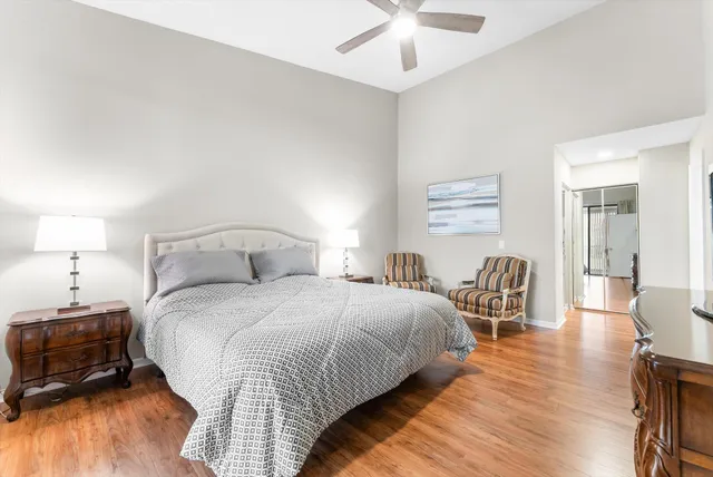 a bedroom with bed and a chair