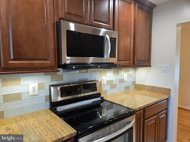a kitchen with a stove and a microwave